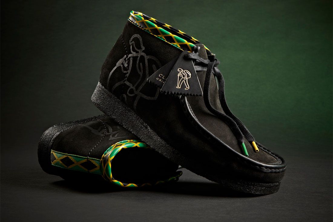 Side view of a pair of black shoes stacked on another.