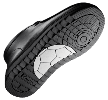 Side view of the sole with a white football ball pattern in the center